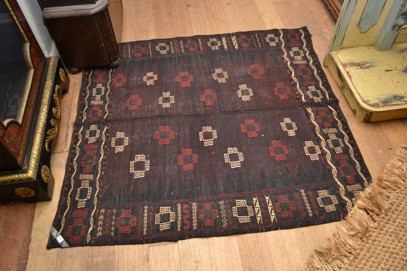 Appraisal: A BALUCH SOFREH RUG IN BURGUNDY RED AND WHITE PATTERNS