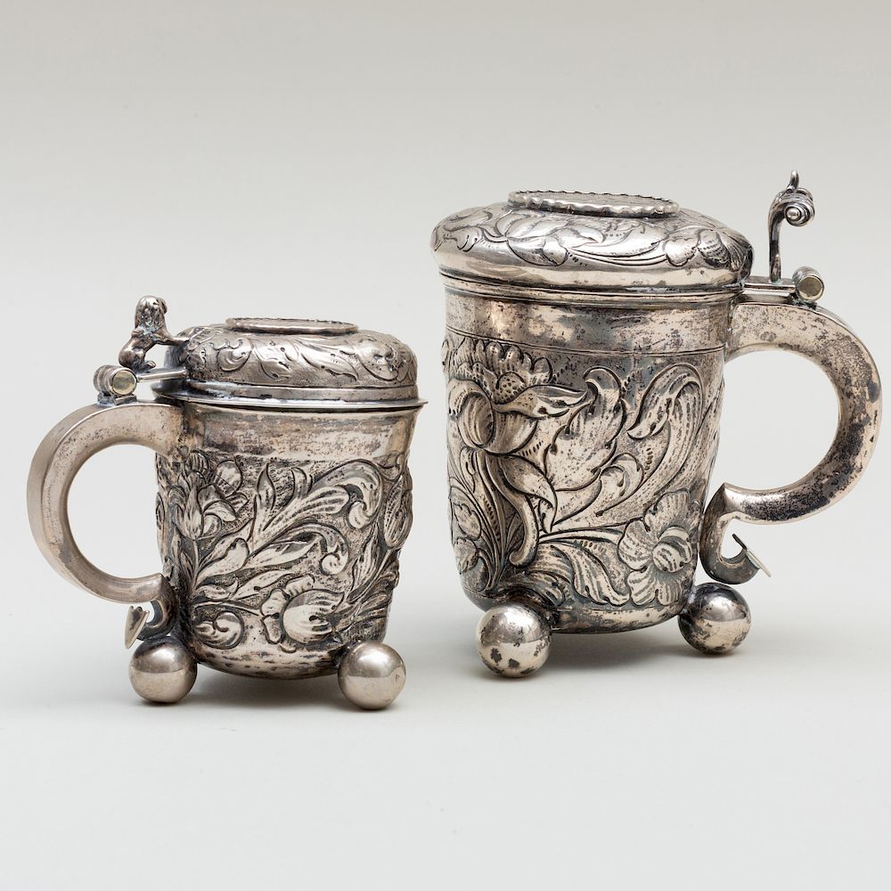 Appraisal: Two Continental Silver Coin Inset Tankards Two Continental Silver Coin