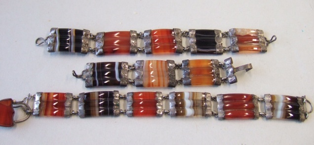 Appraisal: Two Victorian silver mounted vary coloured agate bracelets and a