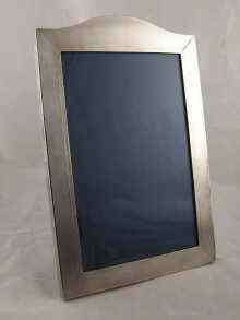 Appraisal: A Britannia standard silver photo frame with wooden back and