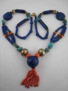 Appraisal: A mixed bead pendant necklace including lapis lazuli coral turqoise