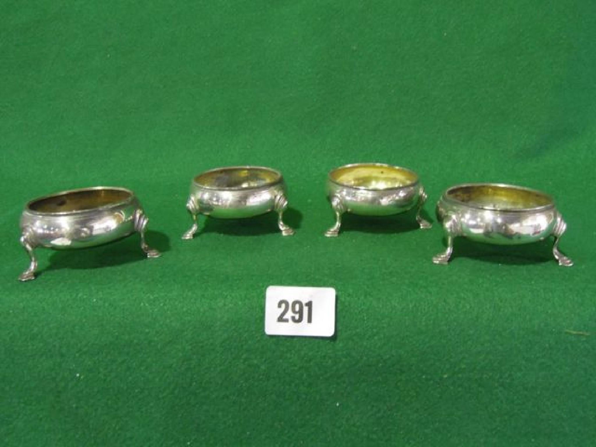 Appraisal: A matched set of four Georgian cauldron salts standing on