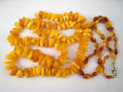 Appraisal: An amber necklace and another approx cm long