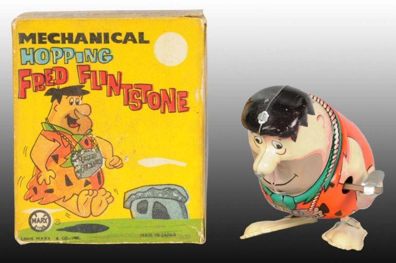 Appraisal: Marx Tin Wind-Up Hopping Fred Flintstone Toy Description Toy includes