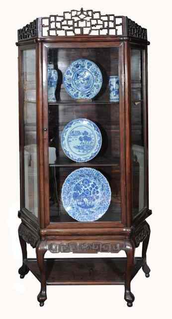 Appraisal: A CHINESE HARDWOOD DISPLAY CASE with open fretwork cornice fitted