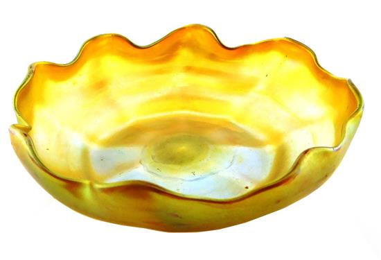 Appraisal: Louis Comfort Tiffany Favrile finger bowl with undulating rim iridescent