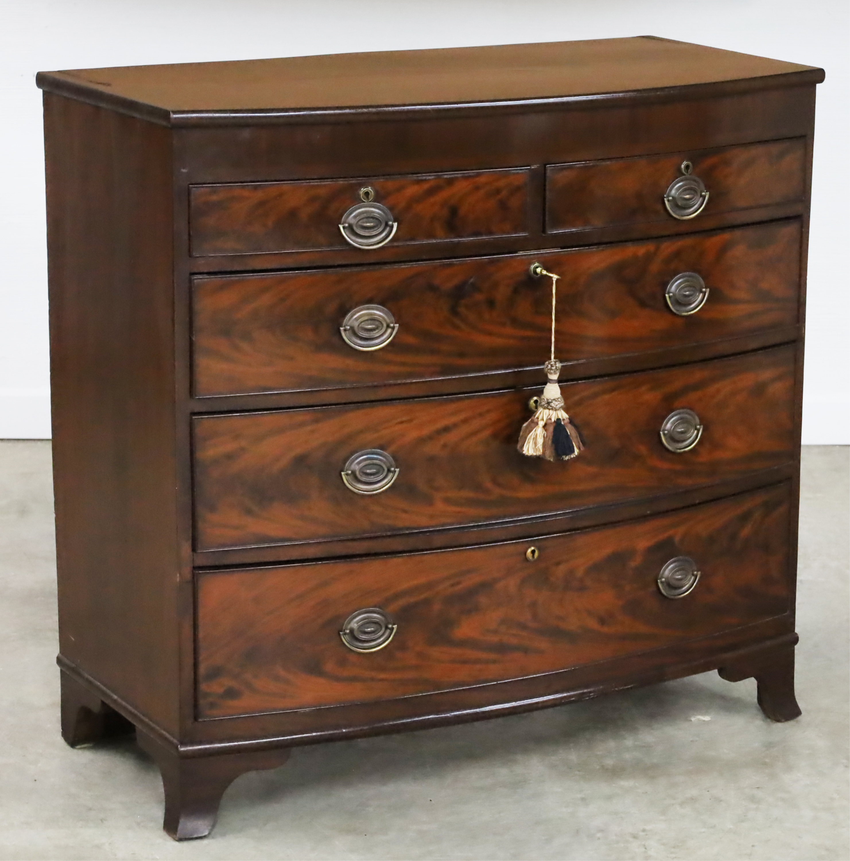 Appraisal: ENGLISH SHERATON MAHOGANY BOWFRONT CHEST English Sheraton mahogany bowfront chest