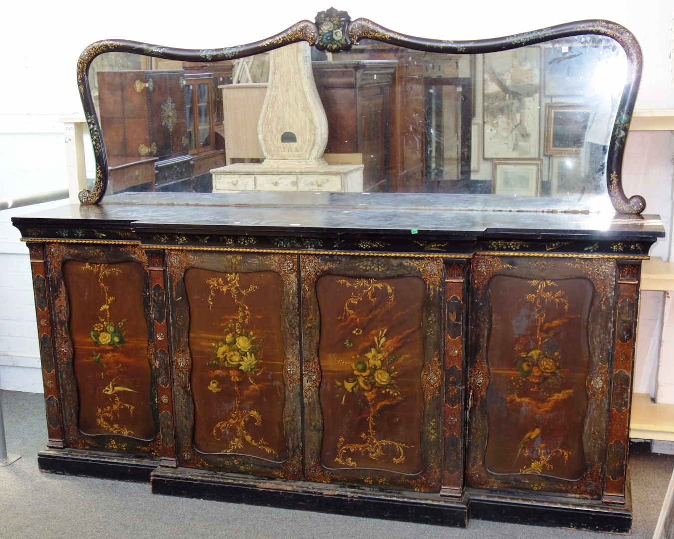 Appraisal: A Victorian black lacquer and floral polychrome painted sideboard the