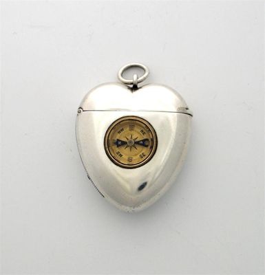 Appraisal: A Victorian heart-shaped vesta holder inset with a compass with