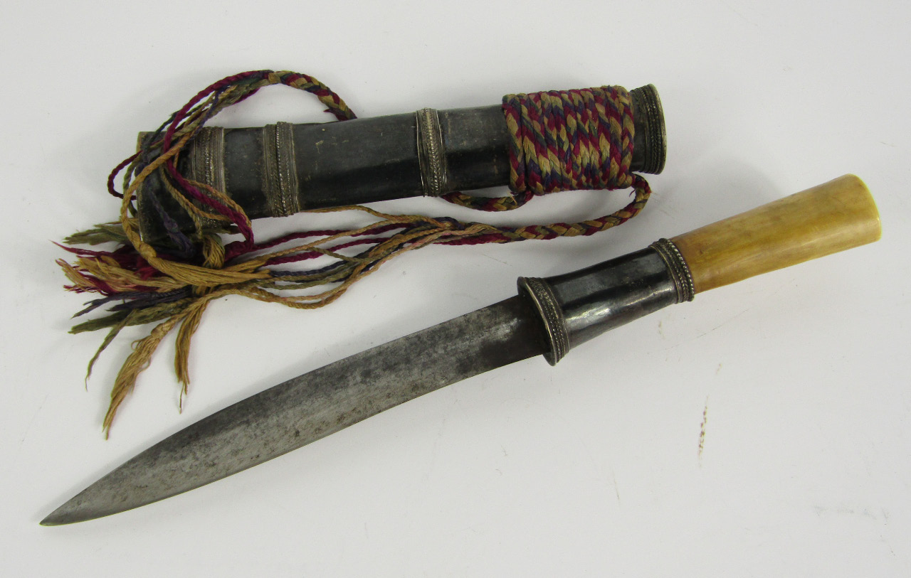 Appraisal: A Middle Eastern white metal and horn knife in a