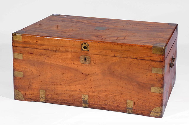 Appraisal: A COLONIAL CAMPHORWOOD AND BRASS BOUND TRAVELLING TRUNK with carrying