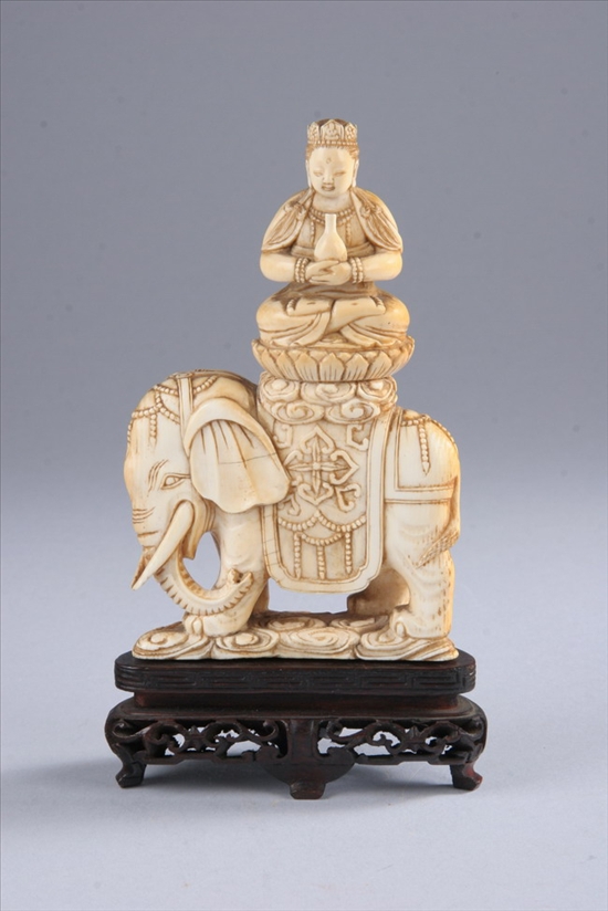 Appraisal: CHINESE IVORY FIGURE OF GUANYIN AND ELEPHANT th century Seated