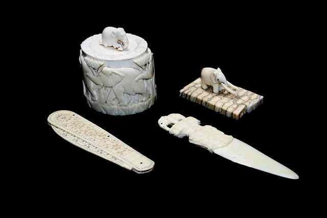 Appraisal: AN INDIAN CARVED IVORY LETTER OPENER decorated with elephant long