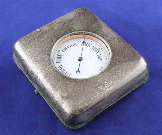 Appraisal: An Edwardian silver mounted leather cased desk barometer the fitted