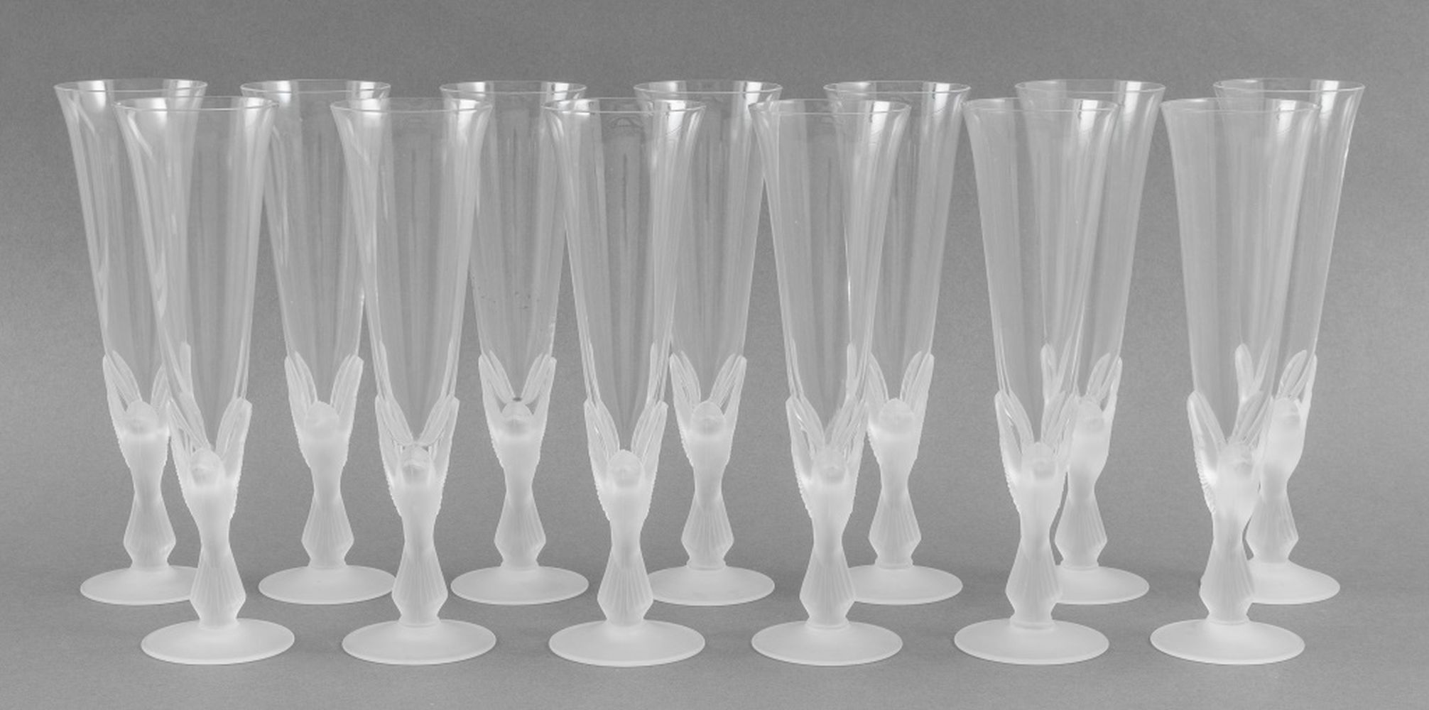 Appraisal: SASAKI WINGS FROSTED GLASS CHAMPAGNE FLUTES Thirteen Sasaki Wings design