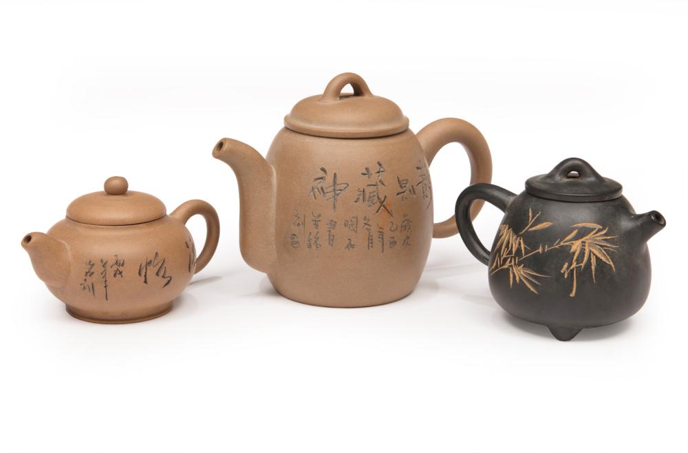 Appraisal: Three Chinese Yixing Pottery Teapots smallest incised with seasonal grasses