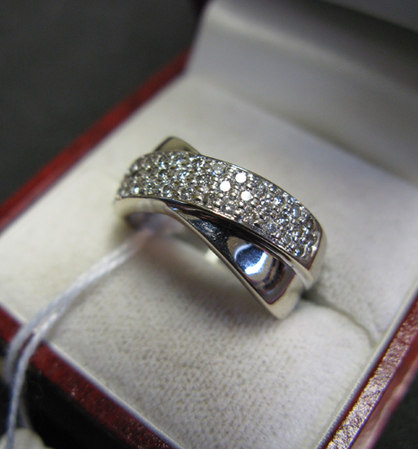 Appraisal: DIAMOND AND FOURTEEN KARAT WHITE GOLD RING Appears as two