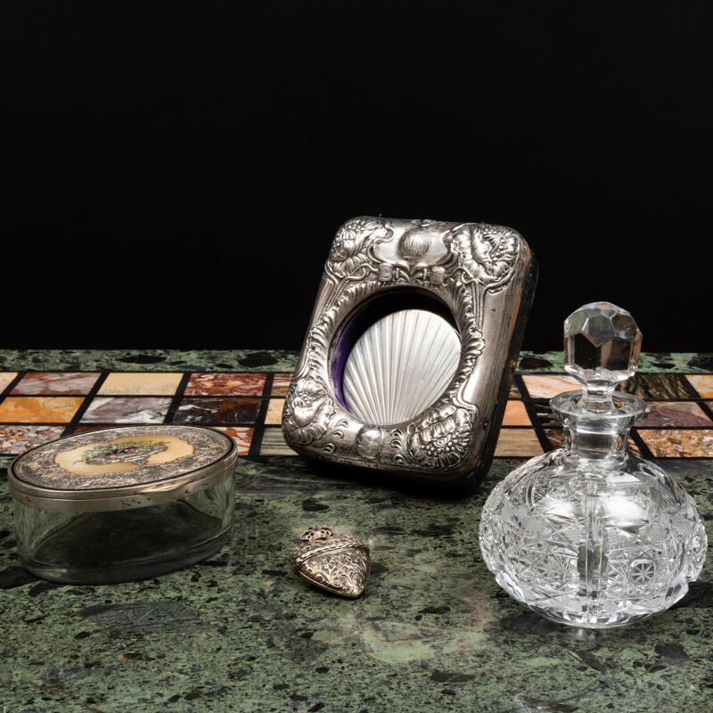 Appraisal: Group of Toilette Articles Comprising An English silver-mounted watch holder