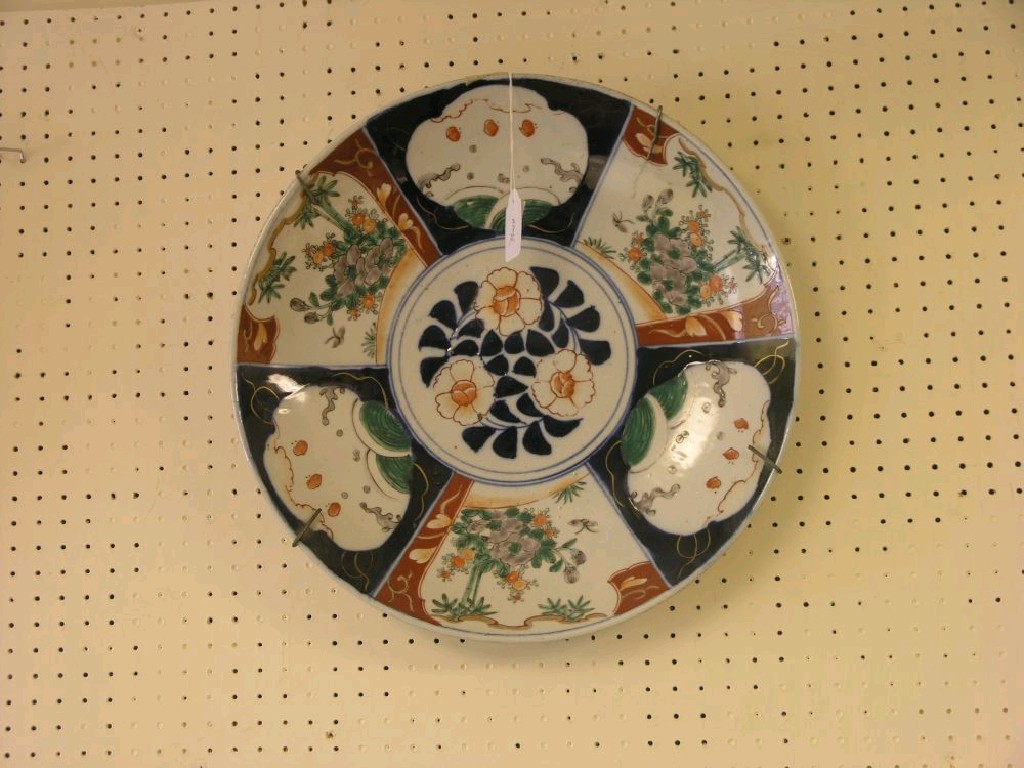 Appraisal: A large Imari porcelain charger painted with alternating panels of