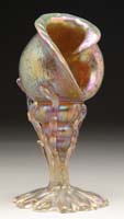 Appraisal: LOETZ SEASHELL VASE Beautiful Loetz vase features gold iridescent oil