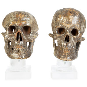 Appraisal: Two Italian Silvered Wood Memento Mori Skulls TH CENTURY each