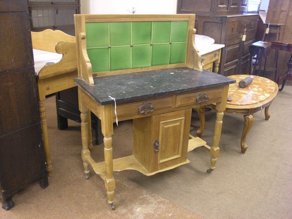 Appraisal: A late Victorian walnut wash stand with tiled marble top