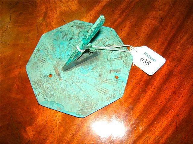 Appraisal: A copper octagonal sun dial engraved with Roman numerals diameter