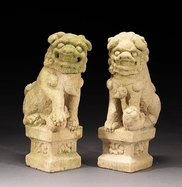 Appraisal: A pair of carved sandstone lions th th Century Each