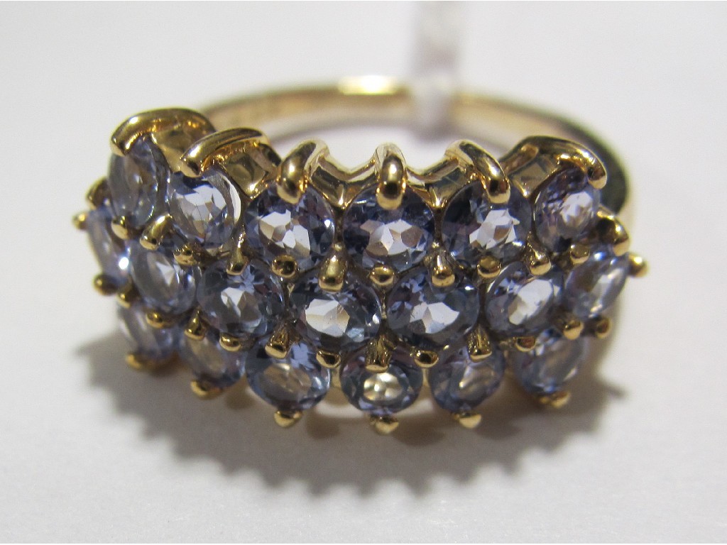 Appraisal: Nine carat gold tanzanite triple row cluster ring