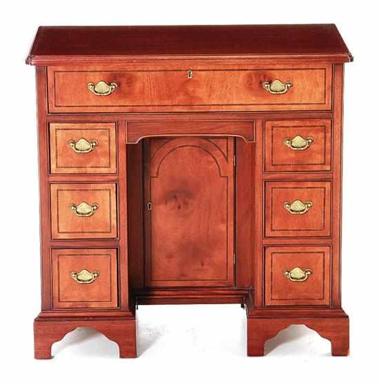 Appraisal: Diminutive mahogany kneehole desk by Hickory Chair rectangular molded top