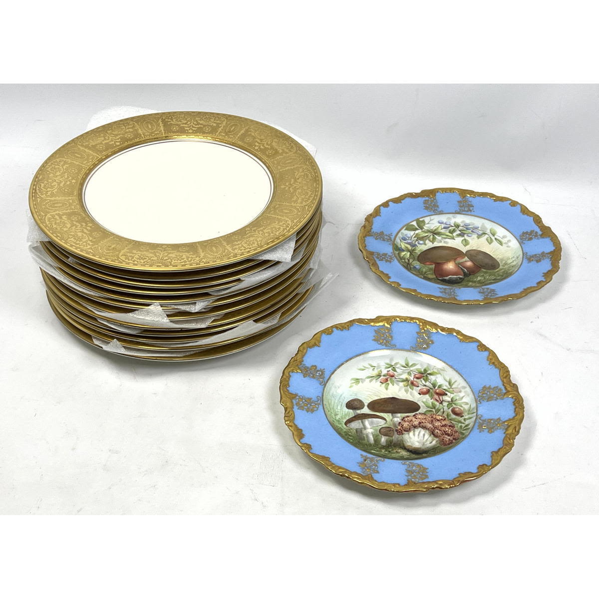 Appraisal: English Porcelain Plates Set Royal Crown Gold rim and Hand