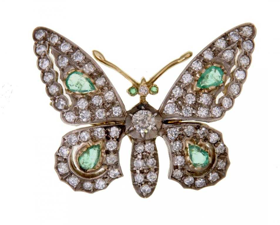 Appraisal: AN EMERALD AND DIAMOND BUTTERFLY BROOCH with emerald eyes and