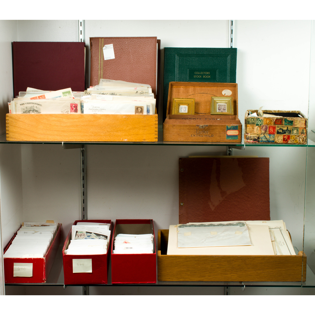 Appraisal: TWO SHELVES OF ASSOCIATED STAMPS Two shelves of associated stamps