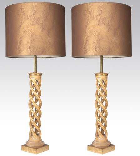 Appraisal: JAMES MONT Pair of carved wood table lamps covered in