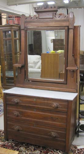 Appraisal: VICTORIAN WALNUT DRESSER WITH ATTACHED MIRROR American c featuring a