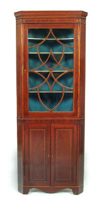 Appraisal: AN EDWARDIAN MAHOGANY STANDING CORNER CUPBOARD crossbanded with stringing moulded