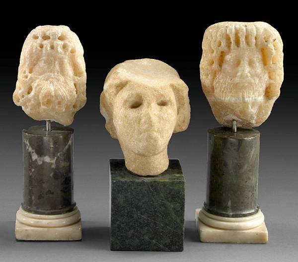 Appraisal: A group of two Roman alabaster heads Eastern Mediterranean nd-