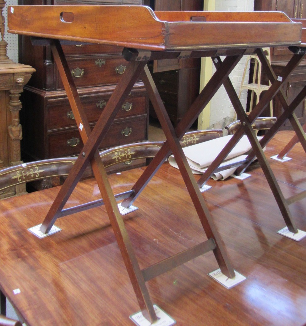 Appraisal: A th century rectangular mahogany butlers tray with pierced handle