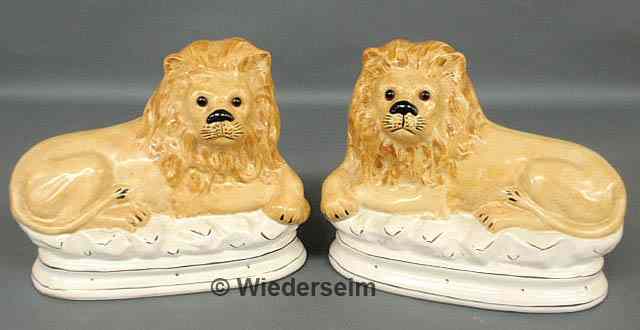 Appraisal: Pair of Staffordshire seated lions with glass eyes h x