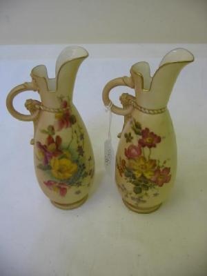 Appraisal: A PAIR OF ROYAL WORCESTER BLUSH PORCELAIN EWERS of ovoid