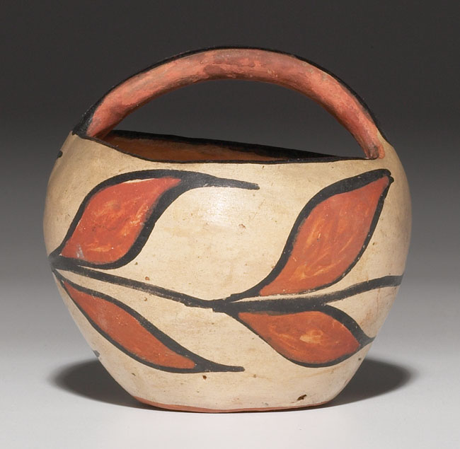 Appraisal: Santo Domingo basket pottery form with a painted polychrome organic