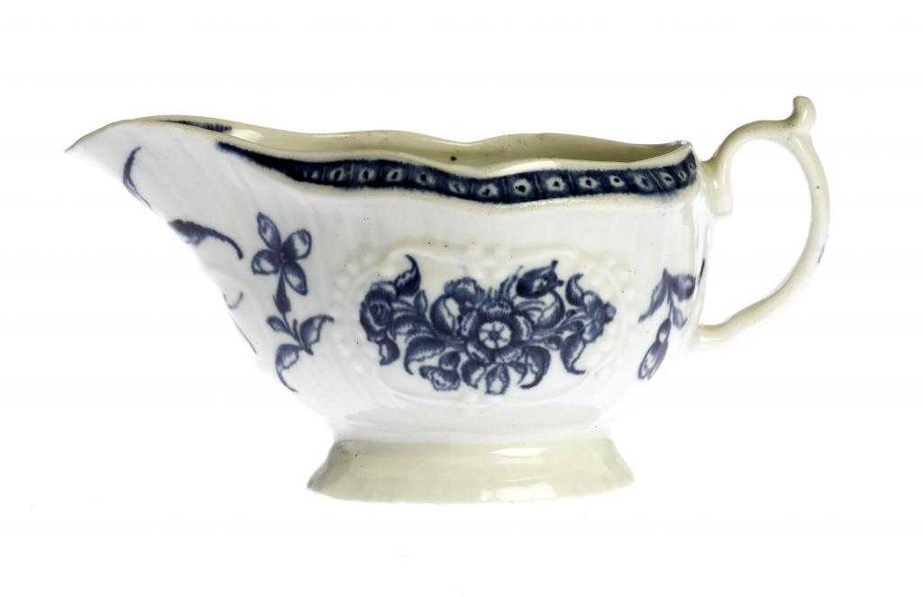 Appraisal: A WORCESTER STRAP FLUTED SAUCE BOAT painted in underglaze blue