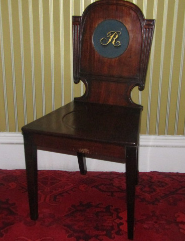 Appraisal: A George IV mahogany hall chair the shaped back painted