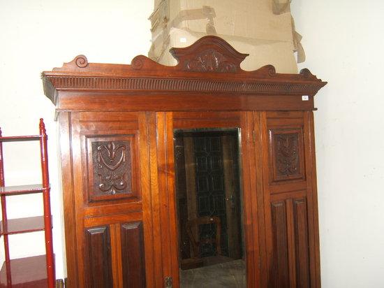 Appraisal: An early th Century mahogany wardrobe with single mirrored door