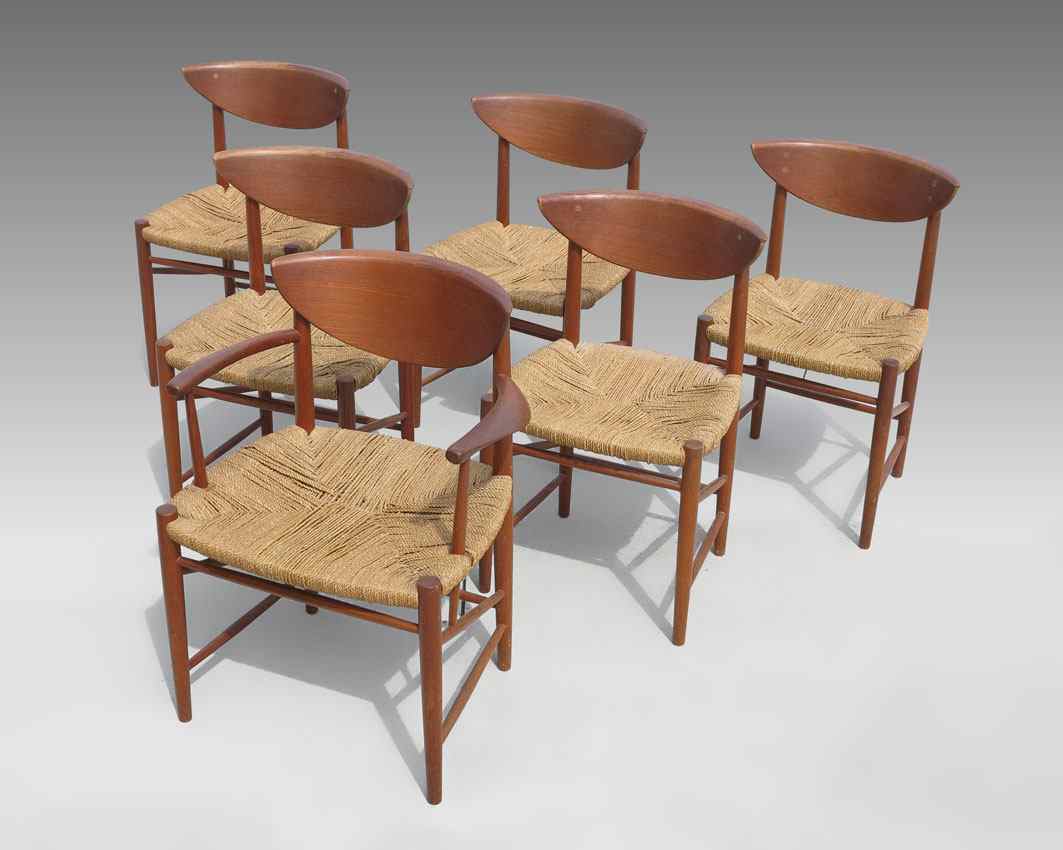 Appraisal: PETER HVIDT DANISH MODERN TEAK DINING CHAIRS With woven grass