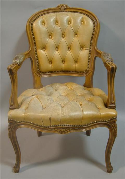 Appraisal: LOUIS XV STYLE OPEN LEATHER ARMCHAIR the crest with central