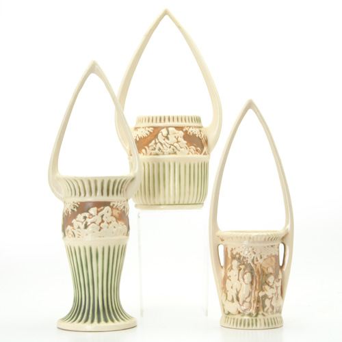 Appraisal: ROSEVILLE Three rare Donatello baskets with tall pointed handles Both