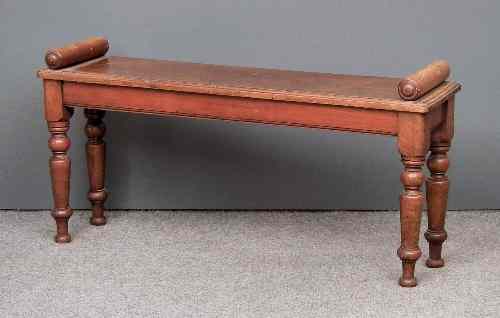 Appraisal: A Victorian mahogany rectangular hall bench with turned roll ends