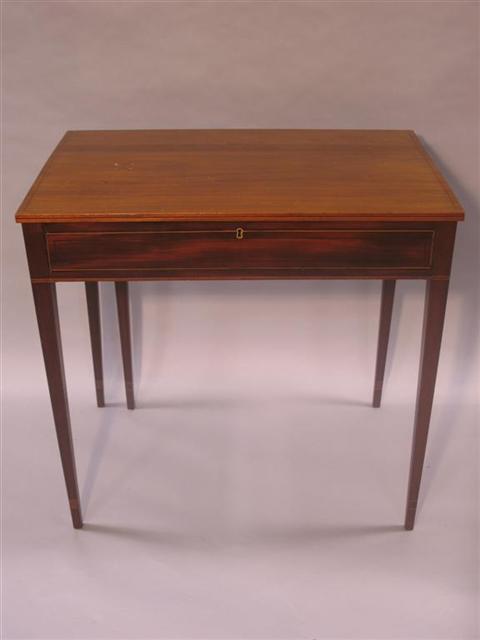 Appraisal: HEPPLEWHITE STYLE MAHOGANY WRITING TABLE The rectangular inlaid hinged top