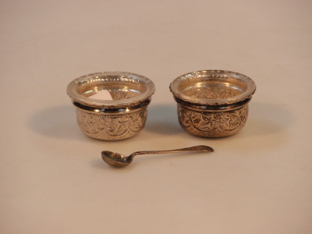 Appraisal: A pair of George V silver salts with fluted rims